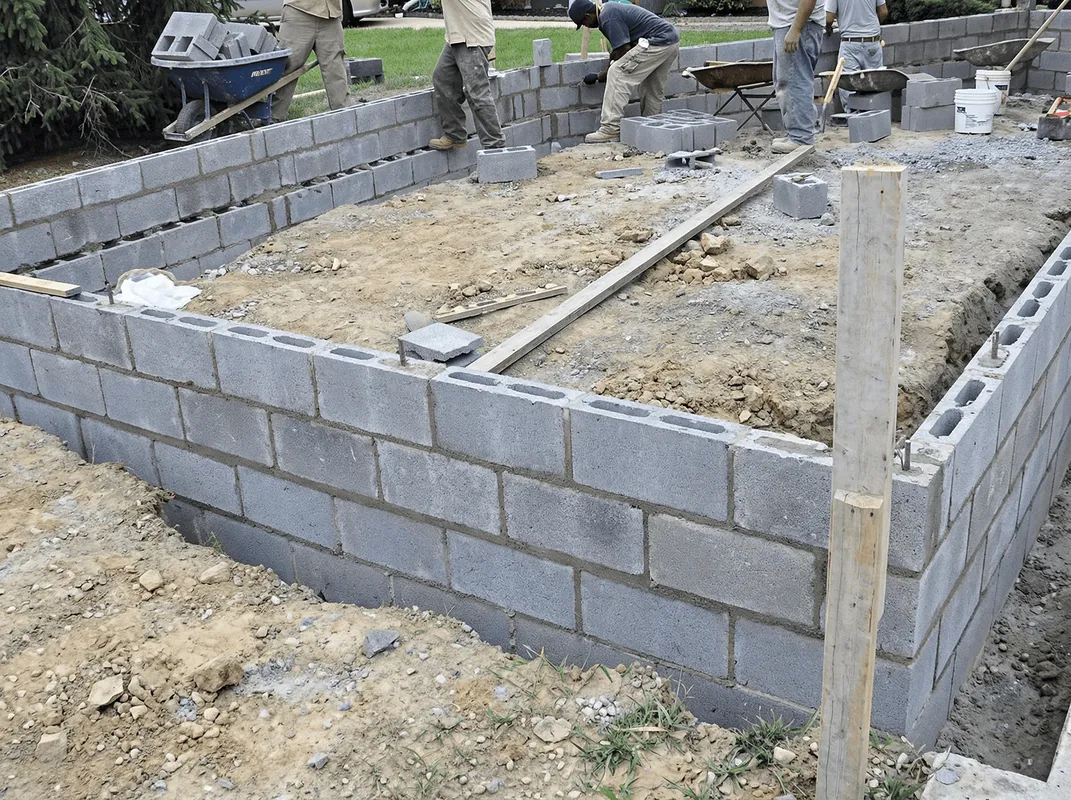 Professionals building a foundation with blocks in Jackson, MS