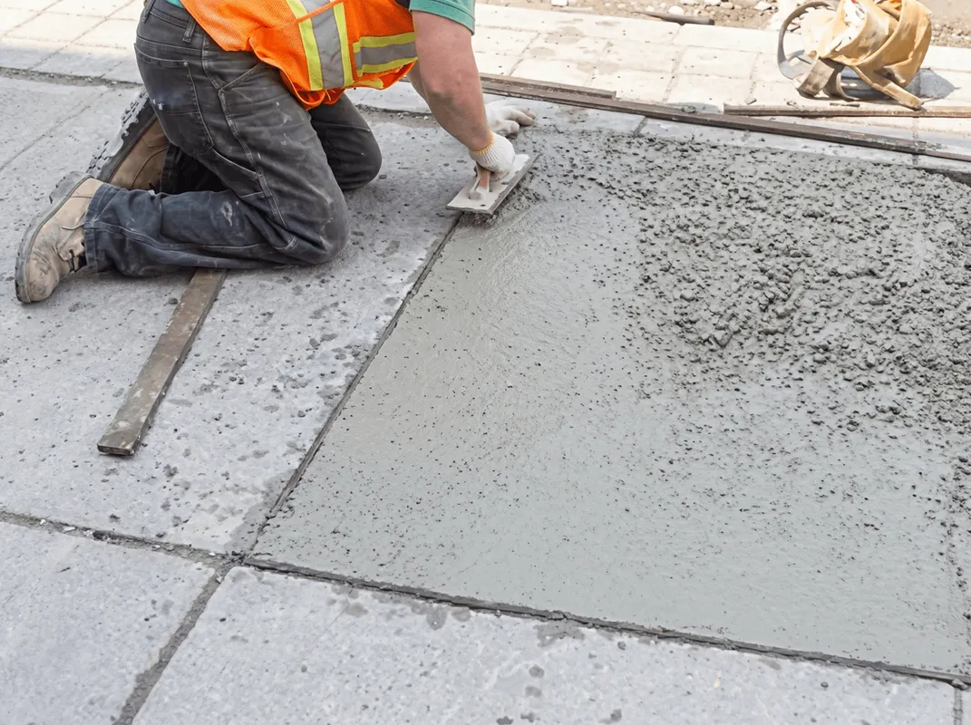 Professional repairing a concrete floor in Jackson, MS